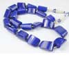 Beads, Lapis (natural), 18-28mm hand-cut Step Cut Tumble,  A grade, Mohs hardness 5-6. Sold per 18 Inch Necklace Royal Blue color beads. Lapis lazuli is a deep blue with a touch of purple and flecks of iron pyrite. Lapis consists of Lapis (blue, calcite (white streaks) and silver flakes of pyrite. Deep blue color gemstones are of best kind. 